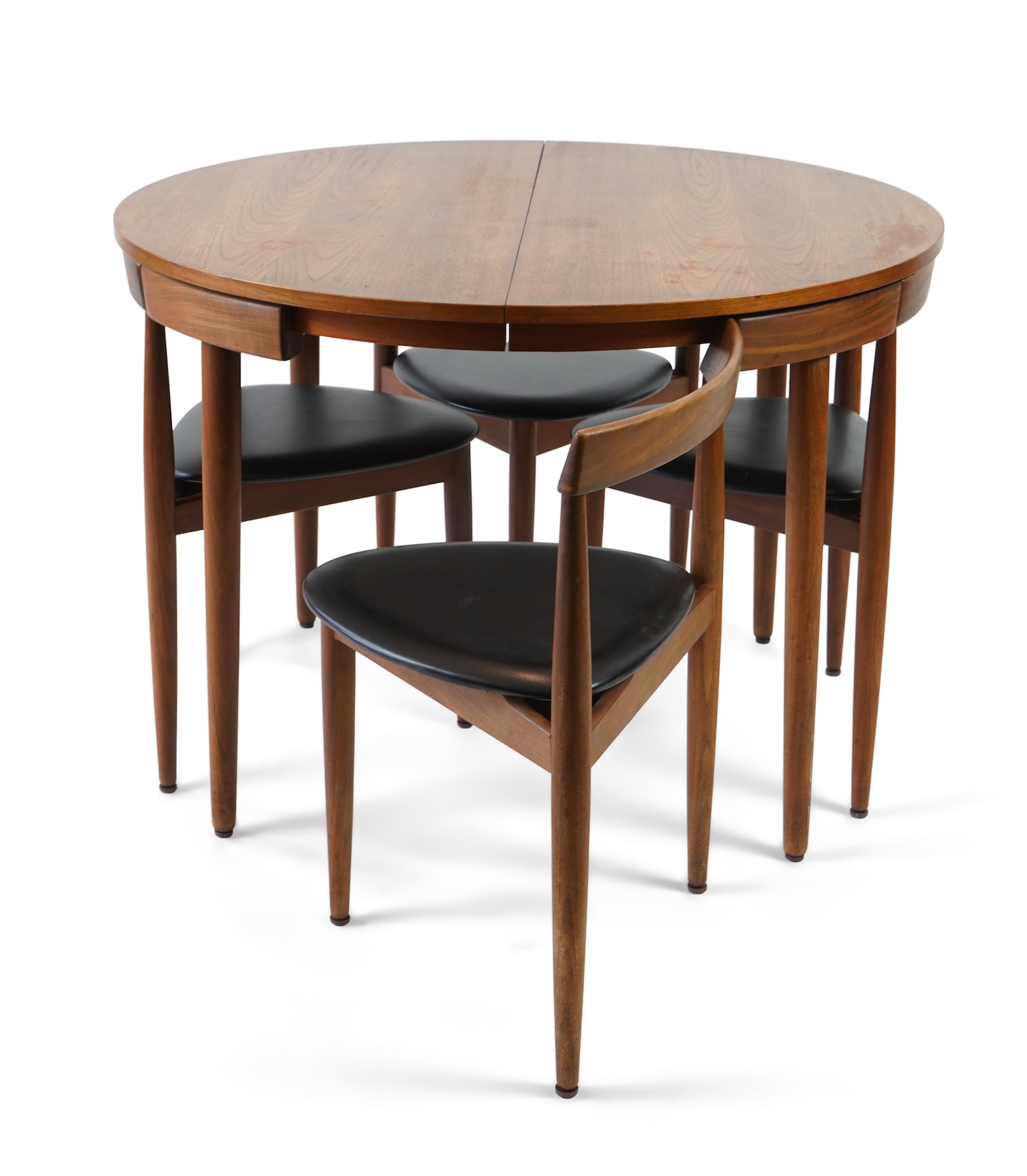 Hans Olsen (Danish, 1919–1992) for Frem Røjle: A Danish teak 'Roundette' extending dining table and four chairs